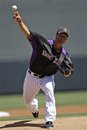 Colorado Rockies starting pitcher Jeremy Guthrie throws to the Cleveland Indians during the first inning of a spring training baseball game on Sunday, April 1, 2012, in Scottsdale, Ariz.