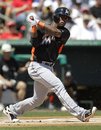 Miami Marlins ' Jose Reyes grounds out in the first inning of a spring training baseball game against the St. Louis Cardinals in Jupiter, Fla., Friday, March 16, 2012. St. Louis won 5-0.