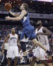 Minnesota Timberwolves ' Luke Ridnour , center, drives past Charlotte Bobcats ' D.J. White , right, and Gerald Henderson , left, during the second half of an NBA basketball game in Charlotte, N.C., Wednesday, March 28, 2012. Minnesota won 88-83.