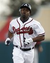 Atlanta Braves ' Michael Bourn runs after his two-run home run against the Houston Astros in the fourth inning of a spring training baseball game in Kissimmee, Fla., Friday, March 16, 2012.