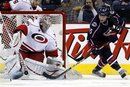 Columbus Blue Jackets ' Derek Dorsett (15) has his shot blocked by Carolina Hurricanes goalie Cam Ward (30) during the third period of an NHL hockey game on Friday, March 23, 2012, in Columbus, Ohio. The Blue Jackets won 5-1.