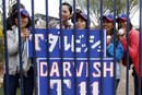 A group of Japanese baseball fans wait outside the Texas Rangers ' locker room for Rangers pitcher Yu Darvish prior to his first appearance in a spring training baseball game against the San Diego Padres , Wednesday, March 7, 2012, in Peoria, Ariz.