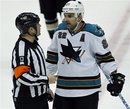 San Jose Sharks defenseman Dan Boyle (22) argues with referee Dan O'Halloran (13) after the Anaheim Ducks score on an empty net goal late in the third period of an NHL hockey game in Anaheim, Calif., Wednesday, March 28, 2012. The Ducks won the game 3-1.