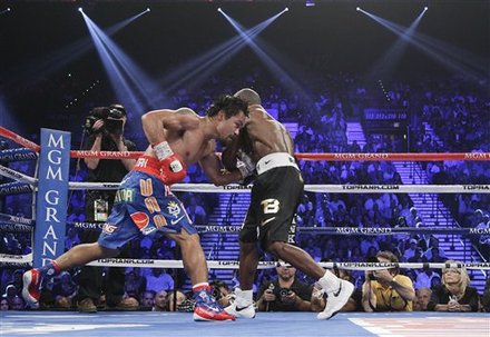 Manny Pacquiao, Left, And Timothy Bradley Exchange Punches