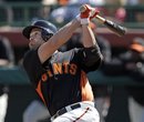 San Francisco Giants ' Freddy Sanchez hits against the Cincinnati Reds in his first game back from injury, during a spring training baseball game Friday, March 9, 2012, in Scottsdale, Ariz.