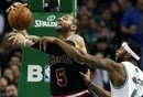 Boston Celtics ' Chris Wilcox , right, fouls Chicago Bulls ' Carlos Boozer (5) in the second quarter of an NBA basketball game in Boston, Sunday, Feb. 12, 2012. The Celtics won 95-91.