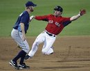 Boston Red Sox base runner Nick Punto advances to third as Tampa Bay Rays third baseman Jeff Keppinger waits for the throw on a single by Jose Iglesias in the first inning of a spring training baseball game in Fort Myers, Fla., Saturday, March 10, 2012.