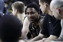 Purdue guard Terone Johnson sits on the bench during the closing minutes of the second half of an NCAA college basketball game against Michigan in Ann Arbor, Mich., Saturday, Feb. 25, 2012. Johnson led his team with 22 points in their 75-61 win.