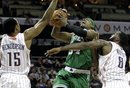 Boston Celtics ' Paul Pierce (34) is fouled as he drives between Charlotte Bobcats ' Gerald Henderson (15) and D.J. White (8) during the second half of an NBA basketball game in Charlotte, N.C., Monday, March 26, 2012. Boston won 102-95.