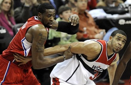 Los Angeles Clippers' DeAndre Jordan, Left, Works To Get Around Washington Wizard' S JaVale McGee And Then Beats Him To