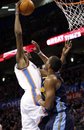Oklahoma City Thunder forward Kevin Durant , left, shoots over Denver Nuggets guard Arron Affalo, right, in the third quarter of an NBA basketball game in Oklahoma City, Sunday, Feb. 19, 2012. Oklahoma City won 124-118 in overtime. Durant scored a career best 51 points.