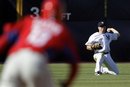 New York Yankees left fielder Colin Curtis , right, throws to second base to force out Philadelphia Phillies ' Freddy Galvis, left, on a hit by Steven Lerud in the ninth inning of a spring training baseball game, Sunday, March 4, 2012, in Tampa, Fla.