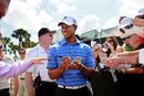 Tiger Woods signs autographs during a practice round for the Honda Classic golf tournament in Palm Beach Gardens, Fla., Tuesday, Feb. 28, 2012. (AP Photo/Palm Beach Post, Allen Eyestone) MAGS OUT TV OUT NO SALES