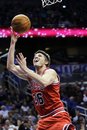 Chicago Bulls ' Kyle Korver goes up for a shot on a fast break during the first half of an NBA basketball game against the Orlando Magic , Friday, Jan. 6, 2012, in Orlando, Fla. Chicago won 97-83.