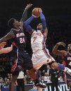 Atlanta Hawks forward Marvin Williams (24) tries to block a shot by New York Knicks forward Carmelo Anthony (7) in the first half of an NBA basketball game at Madison Square Garden in New York, Wednesday, Feb. 22, 2012. The Knicks won 99-82.
