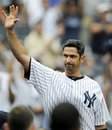 FILE - In this Sept. 25, 2011, file photo, New York Yankees batter Jorge Posada takes a curtain call after hitting a two-run home run during the third inning of the first game of a baseball doubleheader against the Boston Red Sox at Yankee Stadium in New York. The Yankees say Posada is going to announce his retirement Tuesday, Jan. 24, 2012 at Yankee Stadium. The 40-year-old five-time All-Star catcher will end his 17-year big league career with the team that drafted him rather than pursue another team. The Yankees announced Posada's decision in a statement Monday, Jan. 23, 2012.