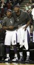 Sacramento Kings ' Isaiah Thomas , left, and DeMarcus Cousins celebrate during the closing moments of the Kings win over the   Boston Celtics in a NBA basketball game in Sacramento, Calif., March 16, 2012.  The Kings won 120-95.