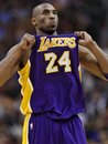 Los Angeles Lakers ' Kobe Bryant adjusts his jersey during the first half of an NBA basketball game against the Phoenix Suns , Sunday, Feb. 19, 2012, in Phoenix.