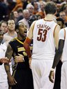 Missouri guard Marcus Denmon, left, confronts Texas center Clint Chapman (53) after scrambling for a rebound on the final play of their NCAA college basketball game, Monday, Jan. 30, 2012, in Austin, Texas. Missouri won 67-66.