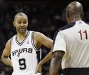 San Antonio Spurs ' Tony Parker , left, of France, talks to referee Derrick Collins during the second half of an NBA basketball game against the Utah Jazz , Saturday, Dec. 31, 2011, at the AT&T Center in San Antonio. San Antonio won 104-89.