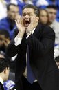 Kentucky head coach John Calipari shouts instructions to his team during the first half of an NCAA college basketball game against Lamar in Lexington, Ky., Wednesday, Dec. 28, 2011.