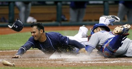 Tampa Bay Rays' Carlos Pena, Left, Is