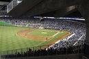 Fans at the new Marlins Park watch a spring training baseball game between the Miami Marlins and the New York Yankees , Monday, April 2, 2012 in Miami. The Yankees won 5-2.