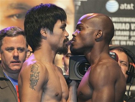 Manny Pacquiao, Left, And Timothy Bradley, Face Off With