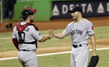Boston Red Sox Relief Pitcher Alfredo Aceves, Right, Is