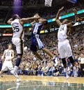 Utah Jazz forward Al Jefferson (25),left,  and teammate Paul Millsap (24), right,  defend Memphis Grizzlies guard Tony Allen (9)  during an NBA basketball game  at EnergySolutions Arena in Salt Lake City, Utah, Friday, Jan. 6, 2012.