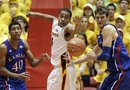 Iowa State guard Chris Allen, center, fights for a rebound with Kansas forward Kevin Young, left, and center Jeff Withey, right, during the first half of an NCAA college basketball game, Saturday, Jan. 28, 2012, in Ames, Iowa. Kansas won 72-64.