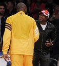 Actor Chris Tucker and Los Angeles Lakers ' Kobe Bryant greet each other before the NBA basketball game between the Dallas Mavericks and Los Angeles Lakers in Los Angeles on Monday, Jan. 16, 2012.