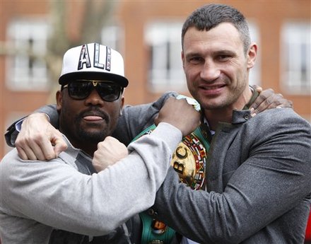 Ukrainian Boxer Vitali Klitschko, Right, Pose For The Media With Challenger British Boxer Dereck Chisora Outside A
