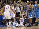Oklahoma City Thunder forward Kevin Durant (35) is helped up by teammate Daequan Cook (14) and New Orleans Hornets guard Jarrett Jack (2) following a foul by Jack in the fourth quarter of an NBA basketball game in Oklahoma City, Wednesday, Jan. 25, 2012. Oklahoma City won 101-91.