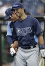 Tampa Bay Rays batting coach Derek Shelton, left, shares a laugh with Rays' Sean Rodriguez beside the batting cage before their spring training baseball game against the Philadelphia Phillies in Clearwater, Fla., Thursday, March 29, 2012.