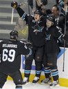 San Jose Sharks center Benn Ferriero (78) celebrates with teammates  left wing Brad Winchester (10) and center Andrew Desjardins (69) after scoring a goal against the Chicago Blackhawks during the third period of an NHL hockey game in San Jose, Calif., Friday, Feb. 10, 2012.  San Jose won 5-3.