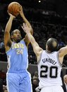 Denver Nuggets ' Andre Miller (24) shoots over San Antonio Spurs ' Manu Ginobili , of Argentina, during the second half of an NBA basketball game, Sunday, March 4, 2012, in San Antonio. Denver won 99-94.