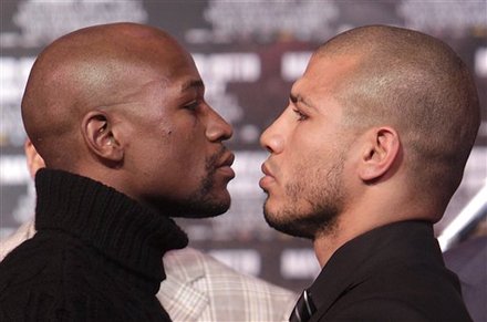 Boxers Floyd Mayweather, Left, And Miguel Cotto Face-off