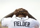 Detroit Tigers first baseman Prince Fielder puts his hat on against the Philadelphia Phillies during a spring training baseball game in Lakeland, Fla., Friday, March 9, 2012.