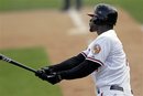 Baltimore Orioles ' Jai Miller hits a three-run double during the eighth inning of a spring training baseball game against the Minnesota Twins on Wednesday, March 7, 2012, in Sarasota, Fla. Baltimore won 6-0.