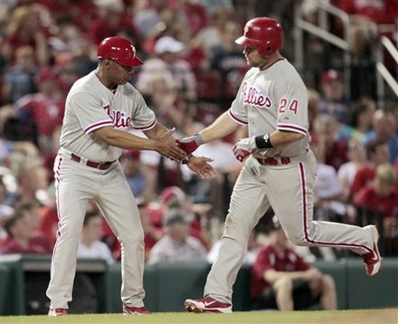 Philadelphia Phillies' Ty Wigginton, Right, Is Congratulated By Third Base Coach Juan Samuel While Rounding The Bases