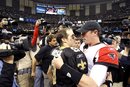 New Orleans Saints quarterback Drew Brees (9) hugs Atlanta Falcons quarterback Matt Ryan (2) after their NFL football game in New Orleans, Monday, Dec. 26, 2011. Brees broke Dan Marino's all time season passing record, as the Saints won 45-16.