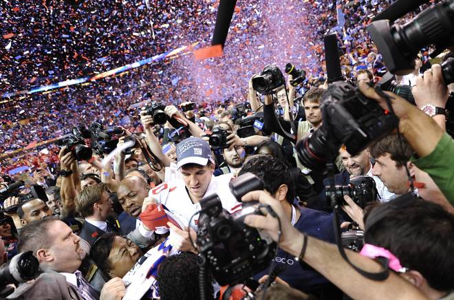 Quarterback Eli Manning Of The New York Giants Celebrates Following Their 21-17 Super Bowl Victory Over The New England