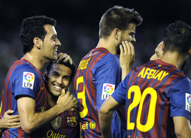 Barcelona's Midfielder Sergio Busquets (L) Celebrates