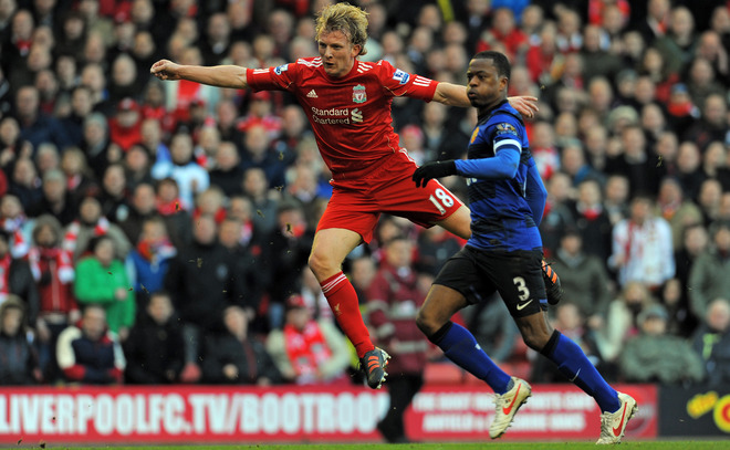 Liverpool's Dutch Striker Dirk Kuyt (L) Scores Their Winning Goal Watched By Manchester United's French Defender