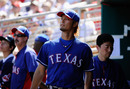 GOODYEAR, AZ - MARCH 13: Yu Darvish #11 of the Texas Rangers walks through the dugout after pitching in the second inning of a spring training baseball game against the Cleveland Indians on March 13, 2012 in Goodyear, Arizona. (Photo by Kevork Djansezian/Getty Images)