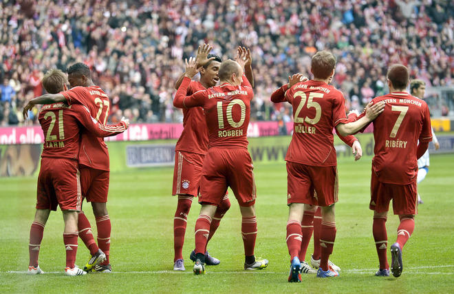 Bayern Munich's Dutch Midfielder Arjen Robben (C), Thomas Mueller (2dR) And Franck Ribery (R) Celebrate With Teammates 