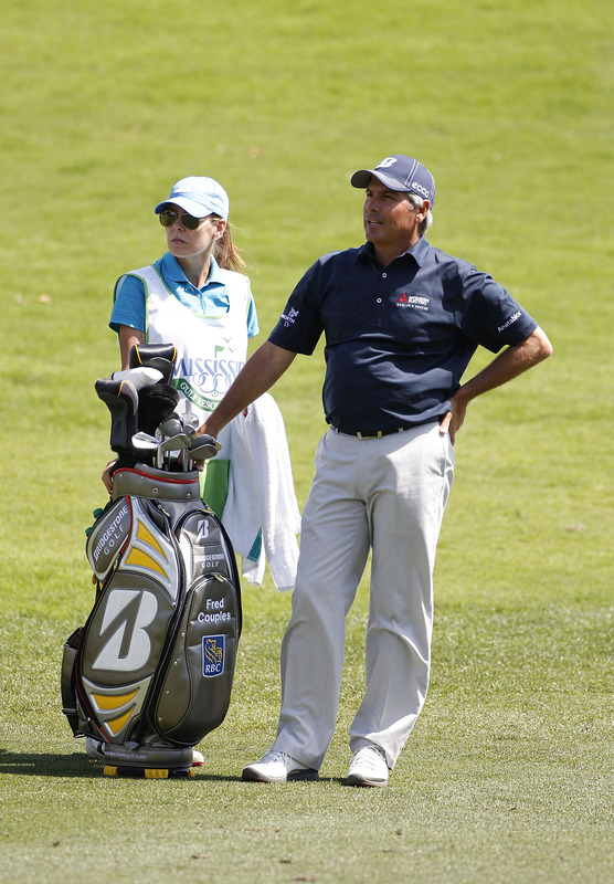 fairway with his caddie Midge Trammell on the 13th hole during the final