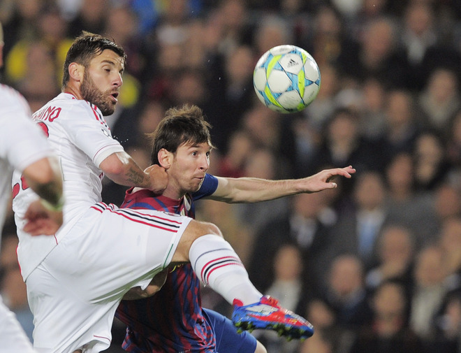 Barcelona's Argentinian Forward Lionel Messi (R) Fights