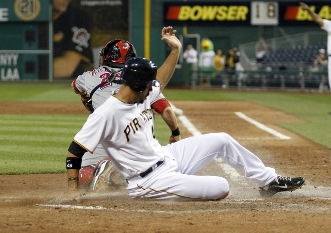  Garrett Jones #46 Of The Pittsburgh Pirates Scores On An RBI Double In The Sixth By Matt Hague #65 (not Pictured)